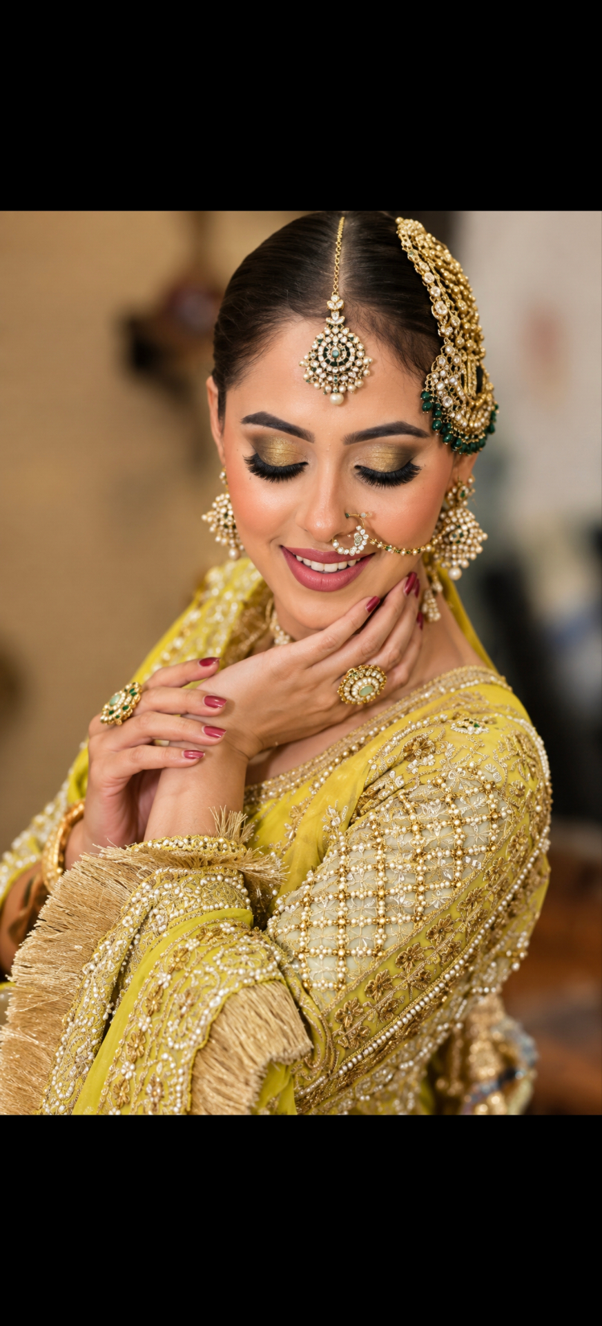 Bride in a yellow and gold bridal look by Hair Masters Jammu